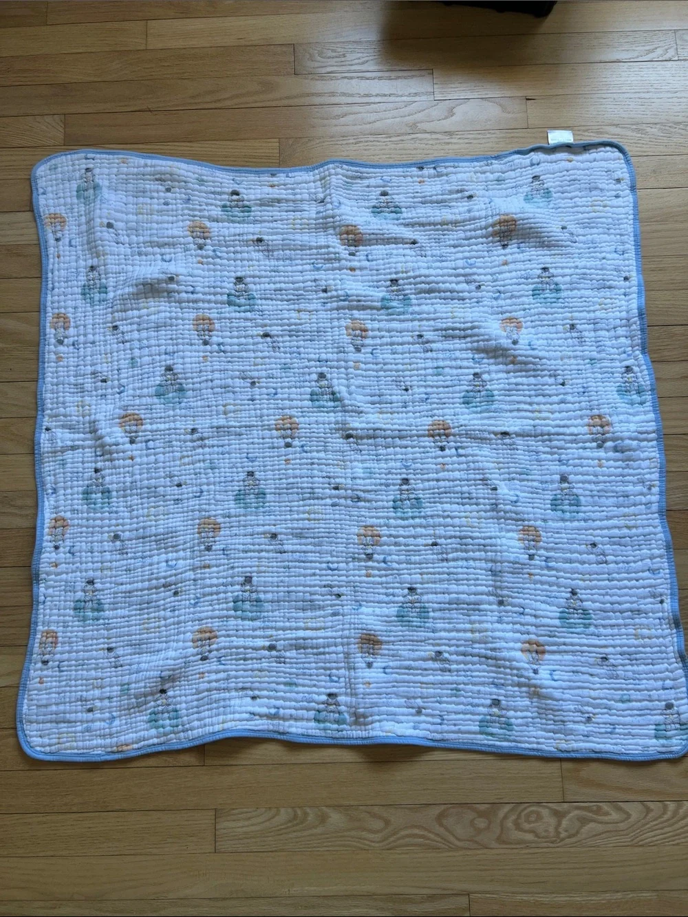 Aden + Anais Baby Muslin Blanket in White space print with Blue Trim